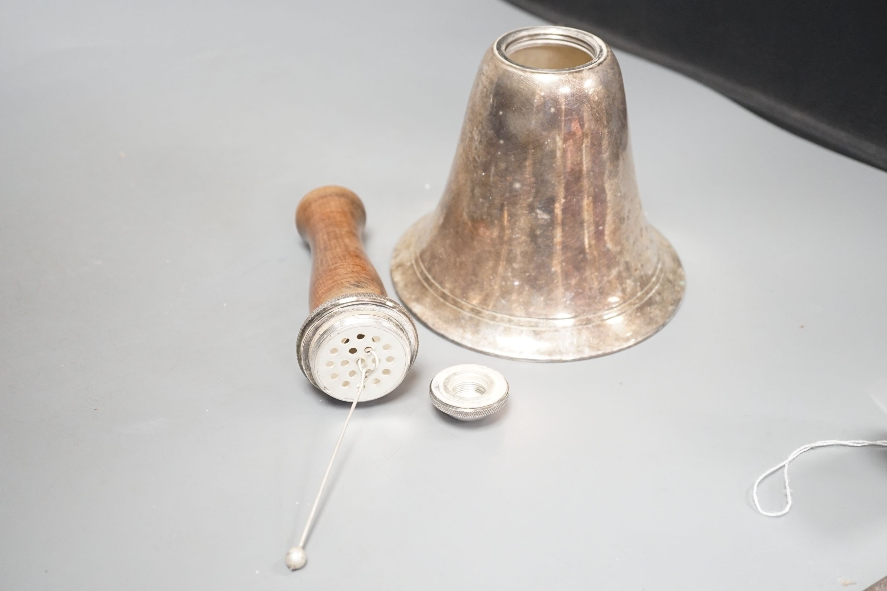 A Dunhill style novelty silver-plated cocktail shaker modelled as a hand bell, 27cm